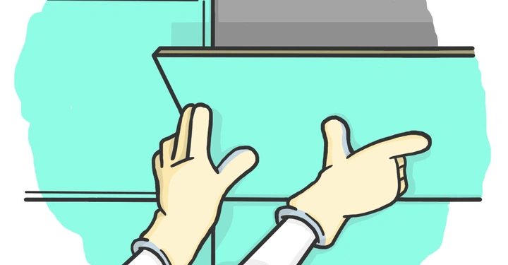 Hände platzieren eine Kachel an einer Wand in einem Raum mit anderen Kacheln.