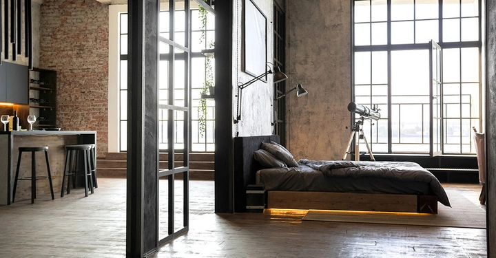 Modernes Luxusarpartment im Loft-Style in dunklen Holztönen mit einer moderner Küche und einem Kingsize-Bed
