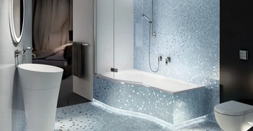 Freistehendes modernes Waschbecken steht vor einem runden beleuchteten Spiegel Badezimmer hat blaue Mosaikwände und -böden mit einer Badewanne und einer Dusche In der Nähe befindet sich ein Schlafzimmer