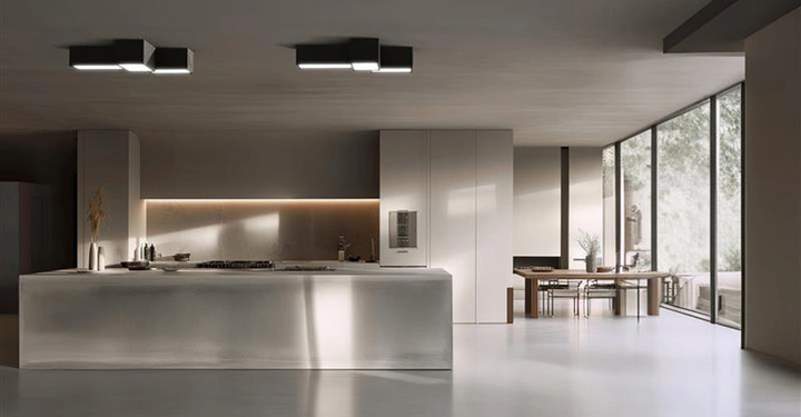 Ein moderne, minimalistische Betonküche mit einer großen Kücheninsel, Sichtestrich und Essbereich