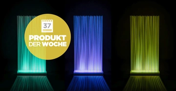 Leuchtröhren ändern ihre Farben von Blau zu Grün aufrecht stehend in einem dunklen Raum. Gelber Kreis mit Text: "37 PRODUKT DER WOCHE".
