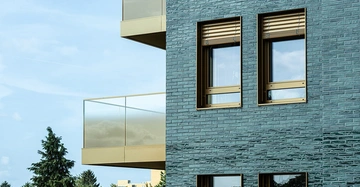 Eine Hausfassade mit Natursteinen von Baumit