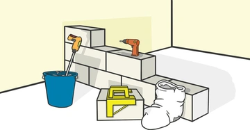 Mehrere graue Ziegelsteine sind aufeinander gestapelt; daneben steht ein blauer Eimer, eine Bohrmaschine, eine Werkzeugkiste und ein Sack in einem teilweise weißen Raum.