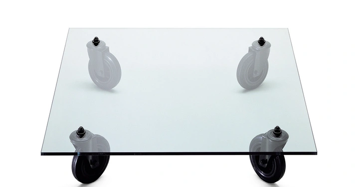Galerie-Bild 6: Glasplatte mit vier schwarzen Rollen steht auf einer weißen Oberfläche.