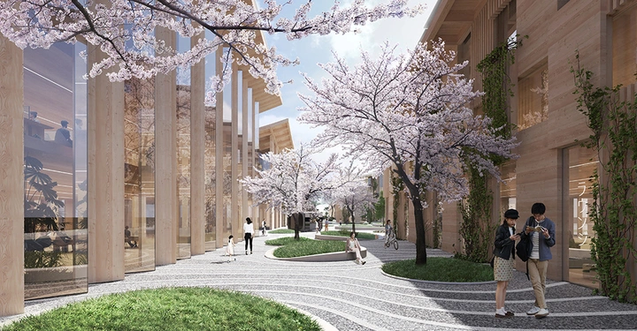 Blühende Kirschbäume stehen entlang eines gewundenen Gehwegs zwischen modernen Holzbauten mit großen Fenstern Personen spazieren und Fahrradfahrer sind zu sehen umgeben von grünen Pflanzen in einer städtischen Umgebung.