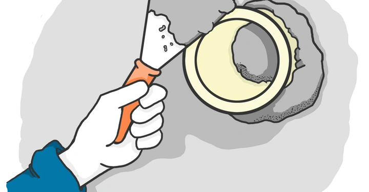 Hand hält Spachtel trägt Putz auf Loch in der Wand auf Klebeband um das Loch zu sichern.