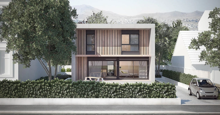 Modernes zweistöckiges Haus steht in der Mitte der Bildmitte von Bäumen umgeben; ein Auto parkt rechts daneben und Berge sind im Hintergrund sichtbar.