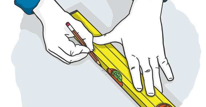 Eine Hand hält ein gelbes Wasserwaagenlineal auf einer grauen Oberfläche während die andere Hand mit einem Bleistift eine Linie entlang des Lineals zieht.