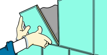 Hände positionieren eine grüne Fliese an der Wand in einem Raum.