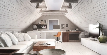 Weißes Sofa mit Kissen steht neben einem Couchtisch in einem gemütlichen weißen Dachzimmer mit Schreibtisch Stuhl Computer Bücherregalen und Fernseher.