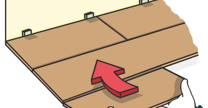 Hände setzen eine Holzplanke auf den Boden ein, darauf eine rote Pfeilstrecke. Der Hintergrund ist eine beige Wand mit kleinen Halterungen.