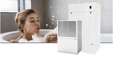 Frau in Badewanne bläst Badeschaum von Händen. Im Vordergrund Freisteller von DHW AIR9 Wärmepumpensystem.