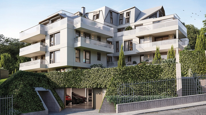 Rendering eines Wohnbaues mit Balkonen, vielen Dachschrägen, umfasst von grün