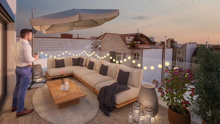 Galerie-Bild 8: Mann steh auf beleuteter Dachterrasse und schaut in die Ferne