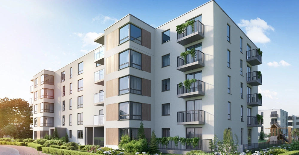 typischer Wohnblock einer Wohnbaugenossenschaft in Wien, fünf Stockwerke, Balkone, viel Grün